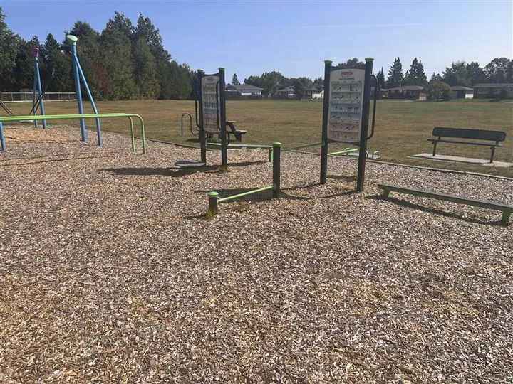 Outdoor fitness equipment at Pinecrest Playground.